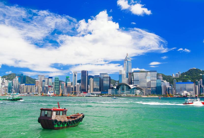 View of the Hong Kong skyline from the harbor as a boat goes by