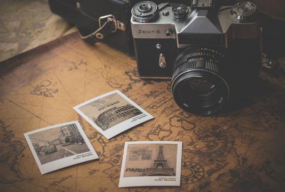 An old-fashioned camera, map, and photos