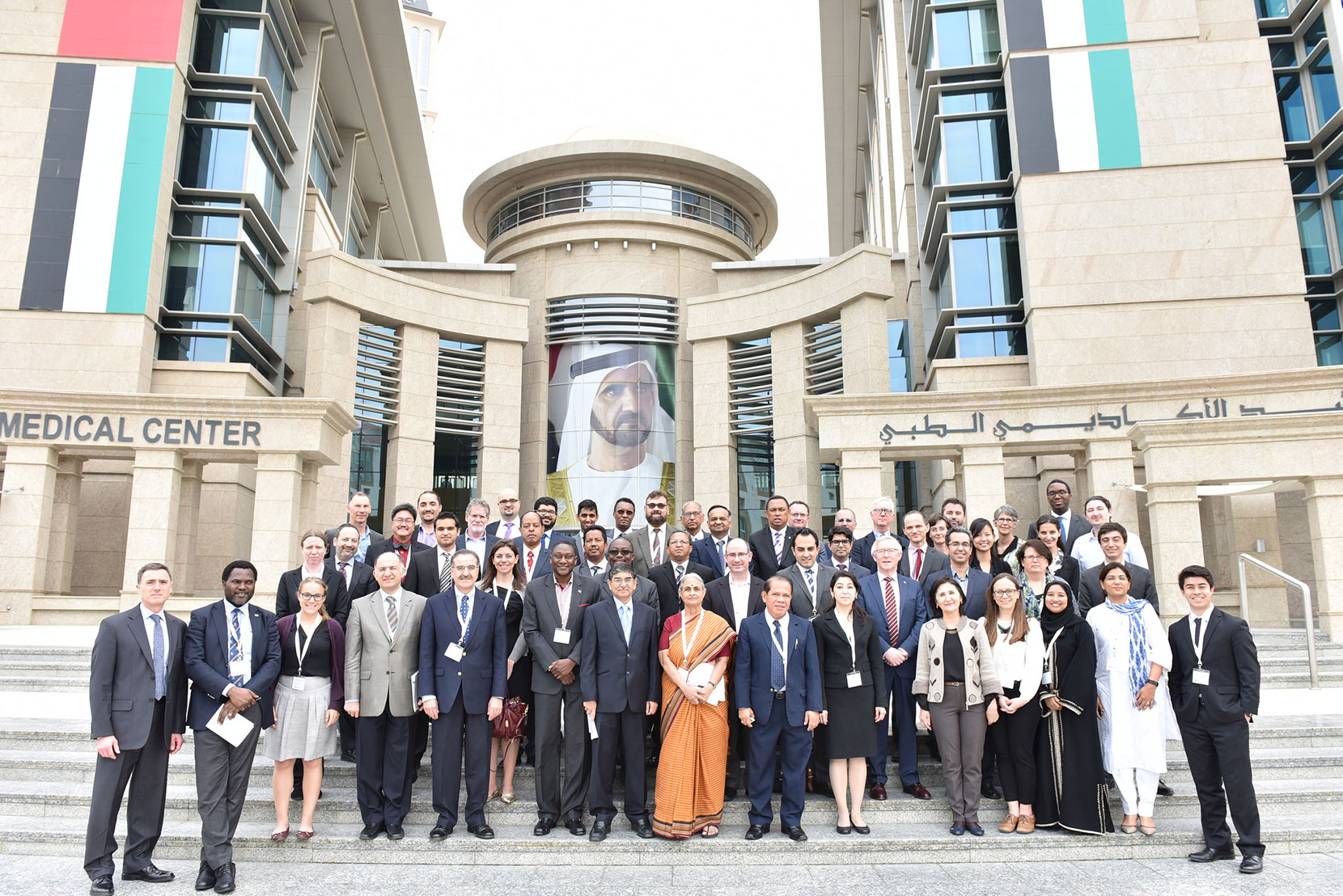 Attendees of the Global Surgery Symposium pose outside the Maktoum Academic Medical Center, home to the HMS Center for Global Health Delivery—Dubai. 