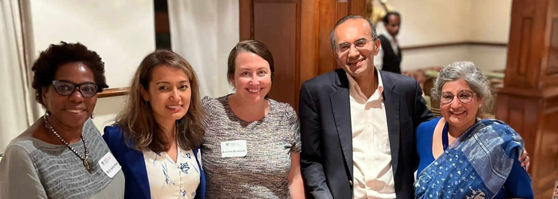 Five members of the HG and India Research team at a reception